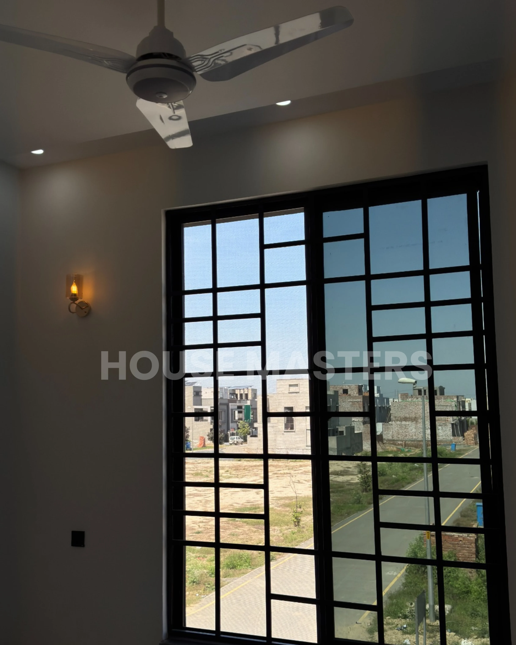 Elegant bedroom with modern decor and lighting in a 5 Marla home in Bahria Orchard